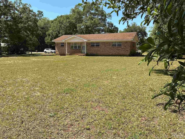 5402 Douglas St, Milton, FL 32570 - ranch-style house with a front lawn and brick siding