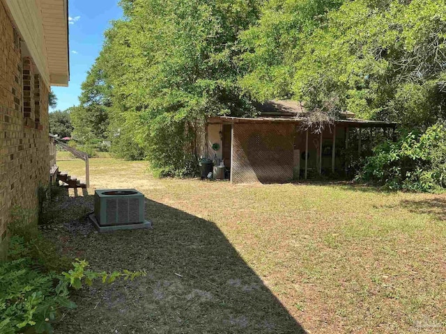 5402 Douglas St, Milton, FL 32570 - view of grassy yard featuring central AC