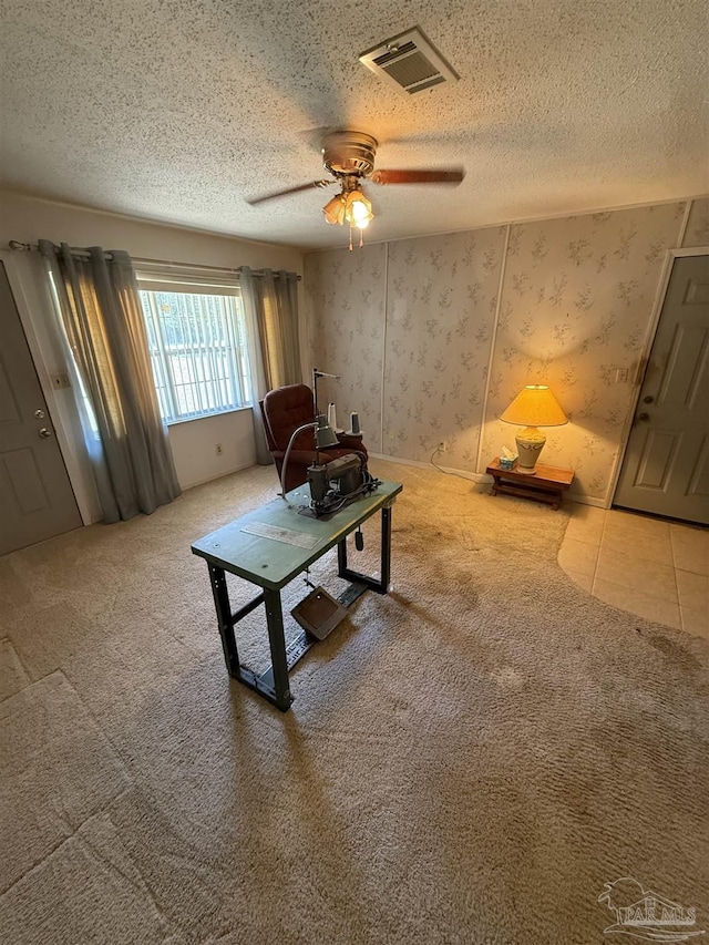 5402 Douglas St, Milton, FL 32570 - living room featuring a ceiling fan, a textured ceiling, carpet flooring, and wallpapered walls