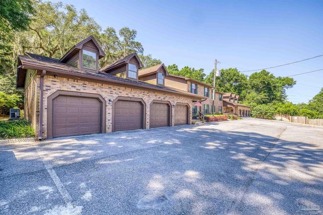 4831 E Olive Rd Unit 2A, Pensacola, FL 32514 - view of side of property featuring community garages and brick siding