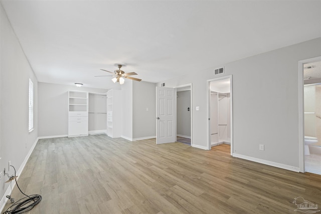 4831 E Olive Rd Unit 2A, Pensacola, FL 32514 - unfurnished living room featuring a ceiling fan, light wood-style flooring, and baseboards