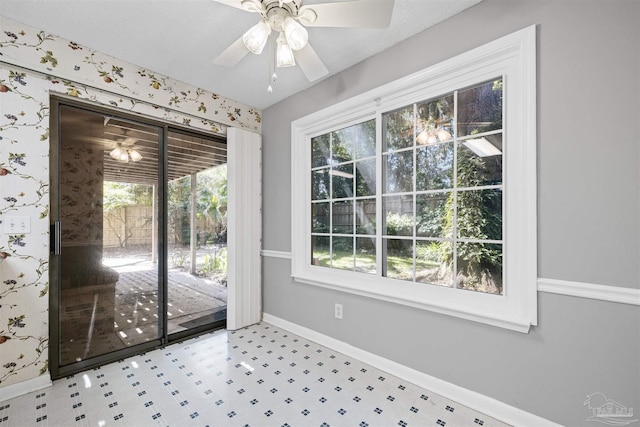 4831 E Olive Rd Unit 2A, Pensacola, FL 32514 - doorway to outside featuring a ceiling fan, baseboards, and tile patterned floors
