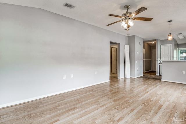 unfurnished room with vaulted ceiling, light hardwood / wood-style flooring, and ceiling fan