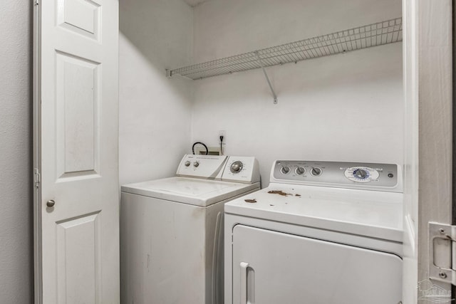 washroom featuring separate washer and dryer