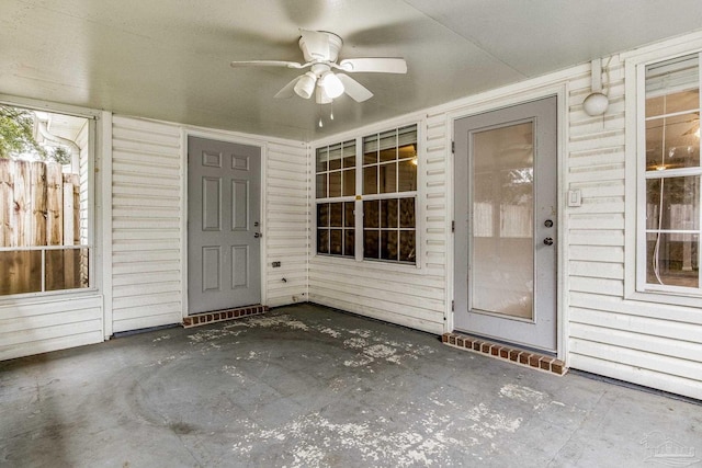 doorway to property featuring a patio area and ceiling fan