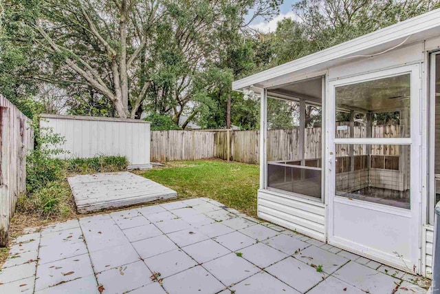 view of patio / terrace featuring a sunroom