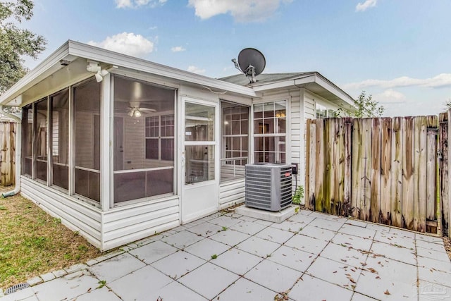 exterior space with a sunroom and cooling unit