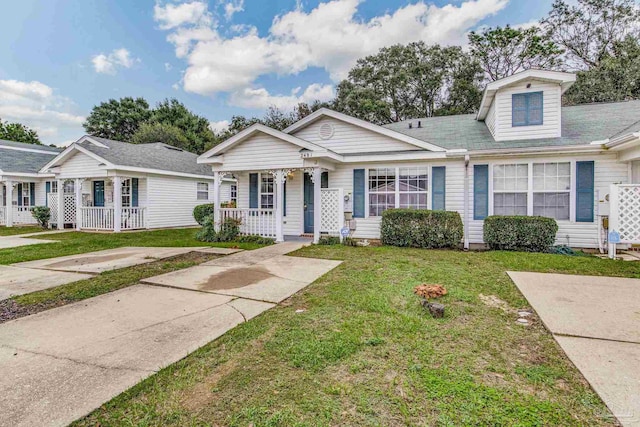 view of front of home with a front lawn and a porch