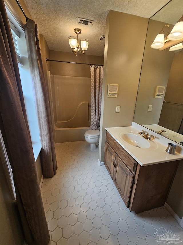 bathroom with vanity, visible vents, shower / bath combo, a textured ceiling, and toilet