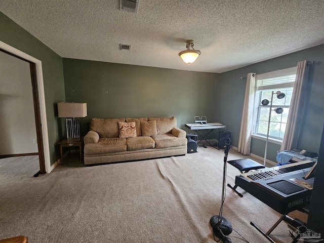 carpeted living area featuring visible vents, baseboards, and a textured ceiling