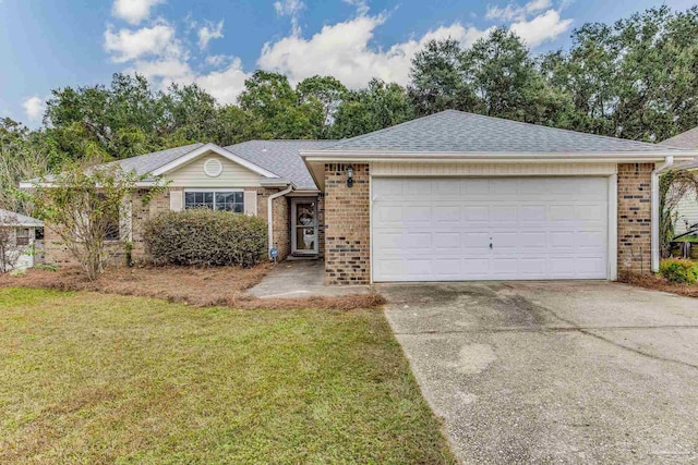 ranch-style house featuring a front yard and a garage