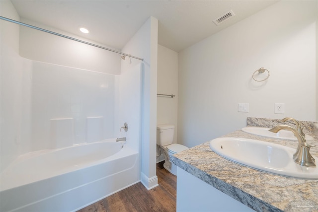 3342 Bliss Ln Unit 9A, Cantonment, FL 32533 - bathroom featuring a sink, toilet, shower / bathing tub combination, wood finished floors, and visible vents