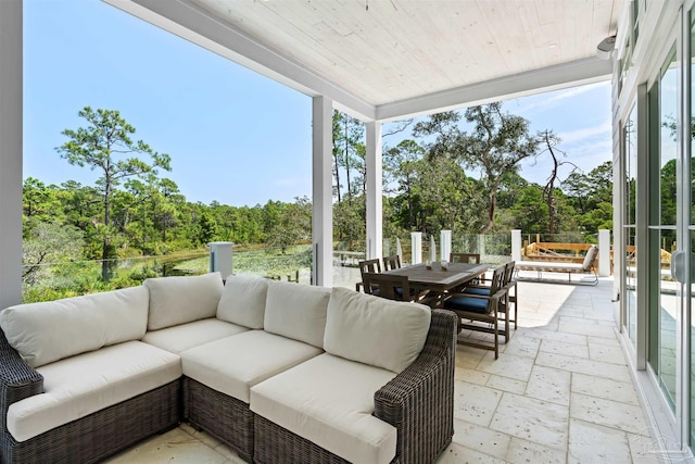 sunroom featuring wood ceiling