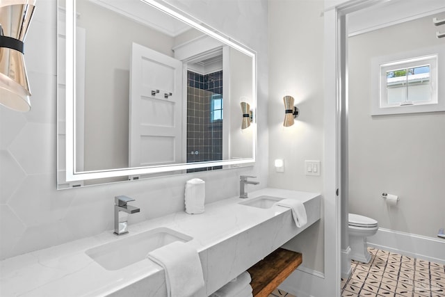 bathroom with tile patterned flooring, vanity, and toilet