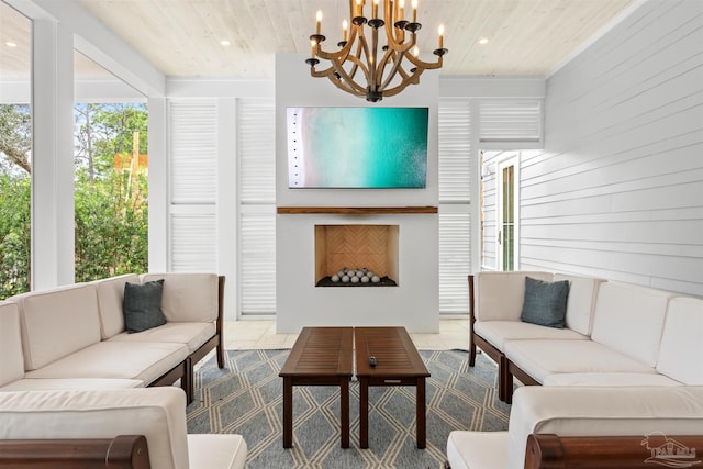 living area with wood walls, wood ceiling, a fireplace, and recessed lighting