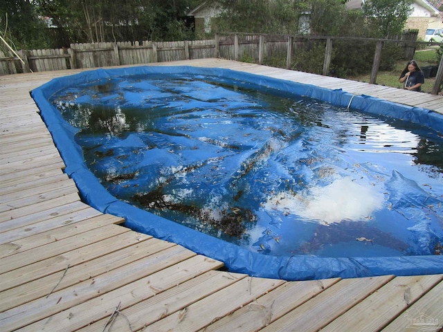 view of pool with a deck, a fenced backyard, and a fenced in pool