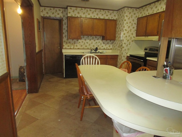 kitchen featuring wallpapered walls, under cabinet range hood, appliances with stainless steel finishes, and brown cabinets