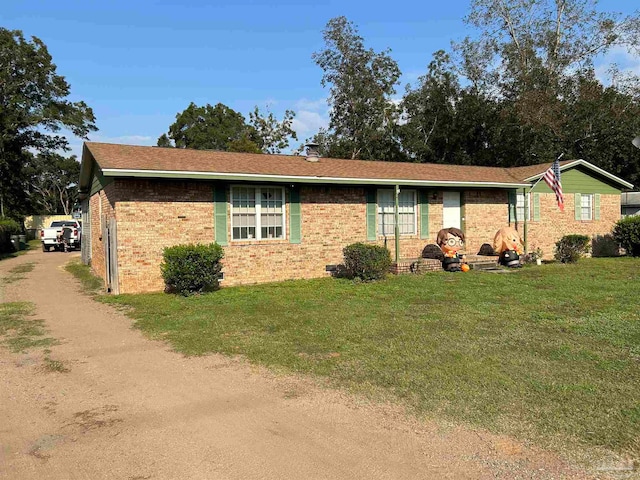 ranch-style house with a front yard