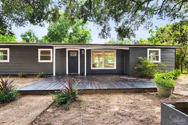 view of front of house featuring a wooden deck