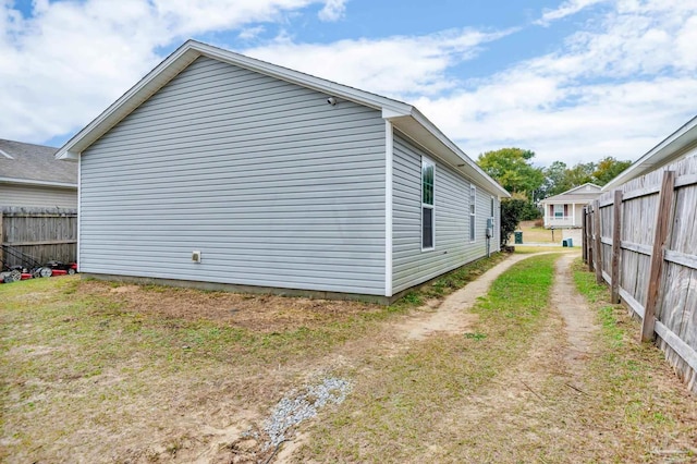 view of property exterior with a lawn