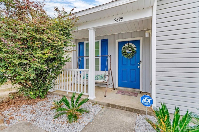 doorway to property with a porch