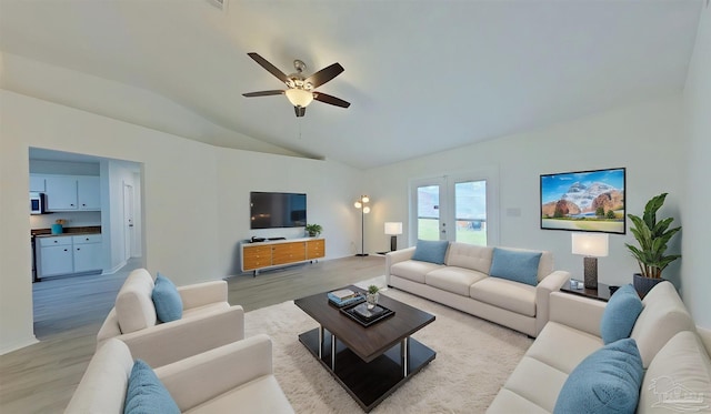 7394 Calle Ln, Navarre, FL 32566 - living room with lofted ceiling, a ceiling fan, and light wood-type flooring