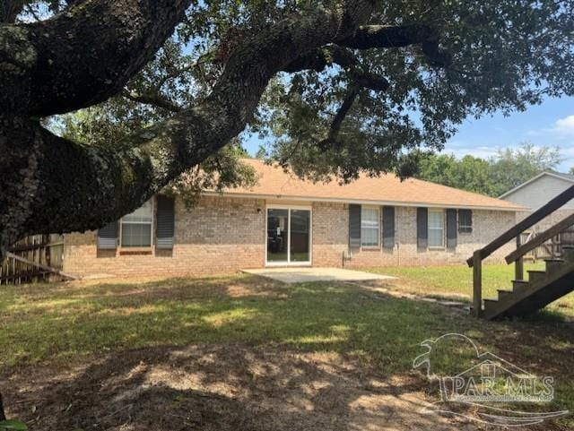 7394 Calle Ln, Navarre, FL 32566 - back of property featuring stairs and brick siding
