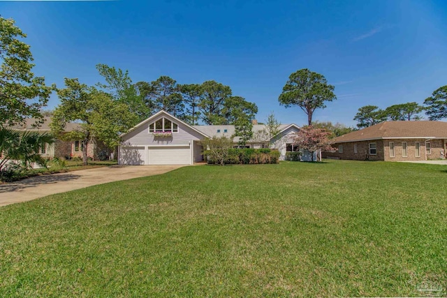view of front facade with a front yard and concrete driveway