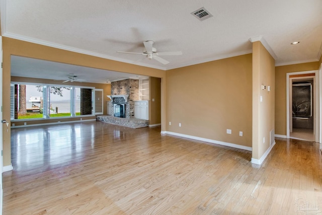 unfurnished living room featuring visible vents, ornamental molding, baseboards, ceiling fan, and light wood finished floors