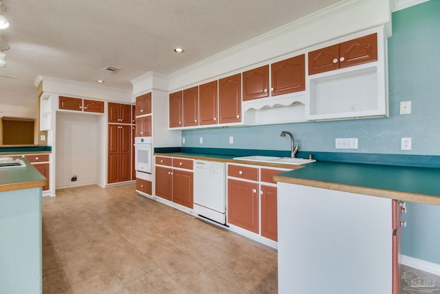 kitchen featuring visible vents, open shelves, a sink, ornamental molding, and white appliances