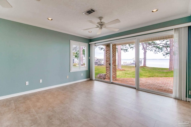 spare room with crown molding, ceiling fan, recessed lighting, baseboards, and visible vents