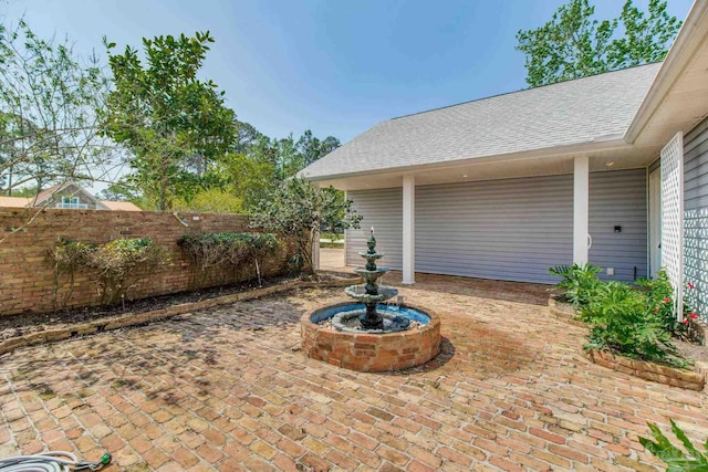 view of patio / terrace featuring fence