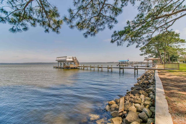dock area with a water view