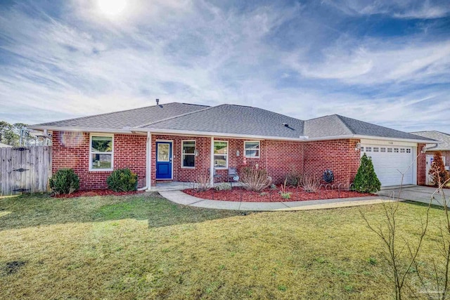 single story home featuring a garage and a front lawn