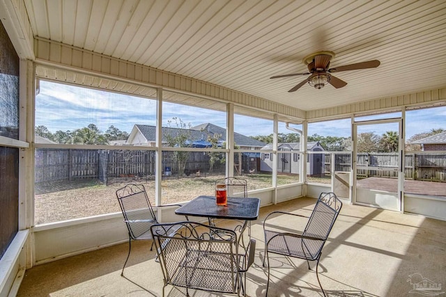 sunroom / solarium with ceiling fan