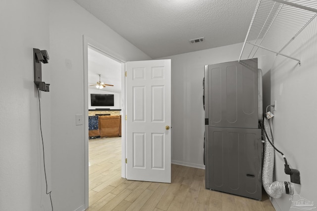 interior space with light hardwood / wood-style floors and a textured ceiling