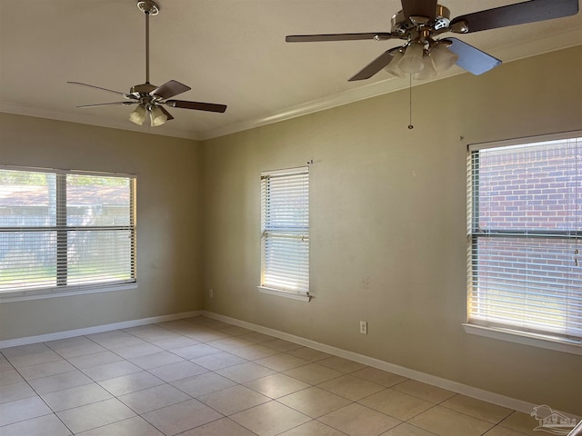 spare room with ornamental molding, ceiling fan, and light tile patterned flooring