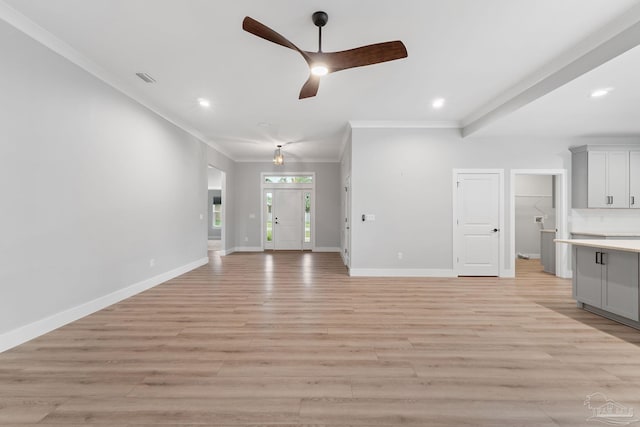 unfurnished living room with ceiling fan, light hardwood / wood-style flooring, and ornamental molding