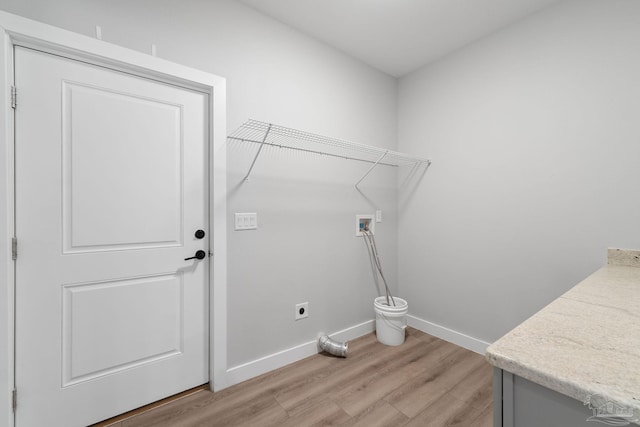 laundry area with hookup for an electric dryer, light wood-type flooring, and washer hookup