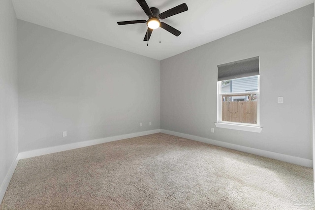 empty room with carpet and ceiling fan