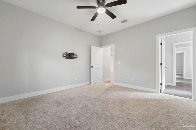 unfurnished bedroom with carpet flooring and ceiling fan