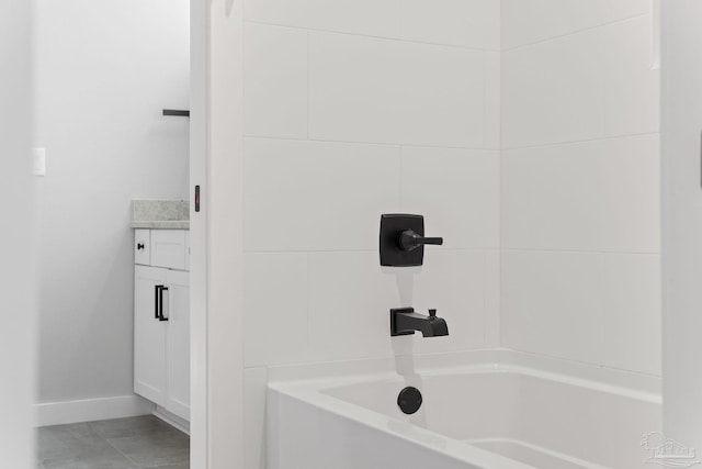 bathroom featuring shower / tub combination, tile patterned flooring, and vanity