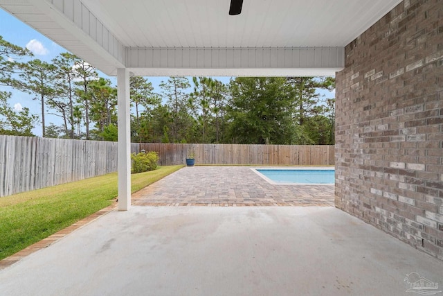 view of patio / terrace with a fenced in pool