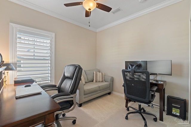 carpeted office space with crown molding and ceiling fan