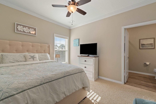 carpeted bedroom with ceiling fan, crown molding, and a textured ceiling