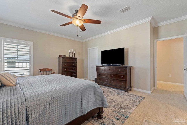 carpeted bedroom featuring a textured ceiling, ceiling fan, and crown molding