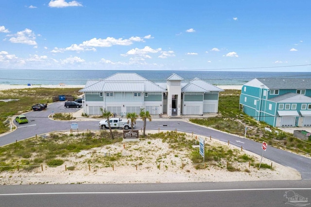 view of front of house with a view of the beach and a water view