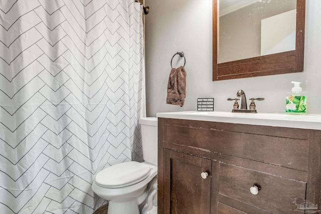 bathroom with toilet, a shower with shower curtain, ornamental molding, and vanity