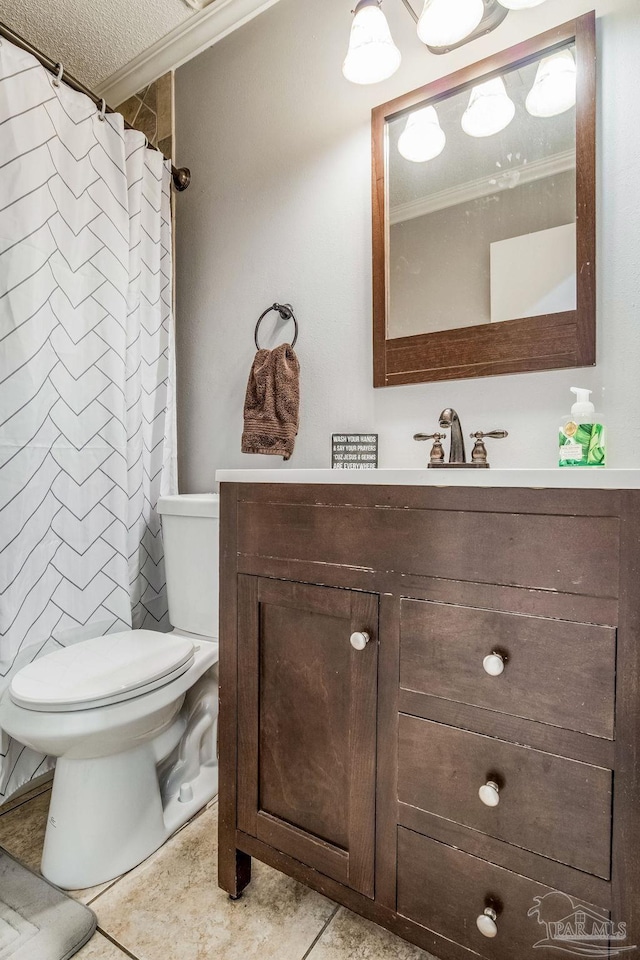 bathroom with a textured ceiling, tile patterned floors, vanity, toilet, and crown molding