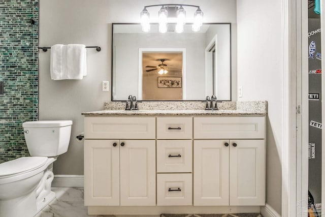 bathroom with ceiling fan, toilet, and vanity